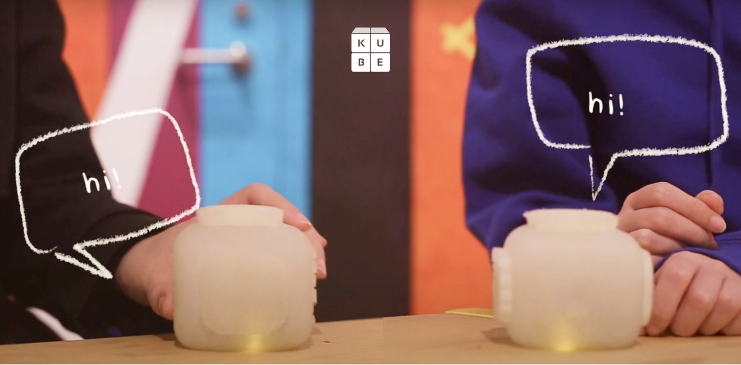 Two children in cooperative play with the cubes