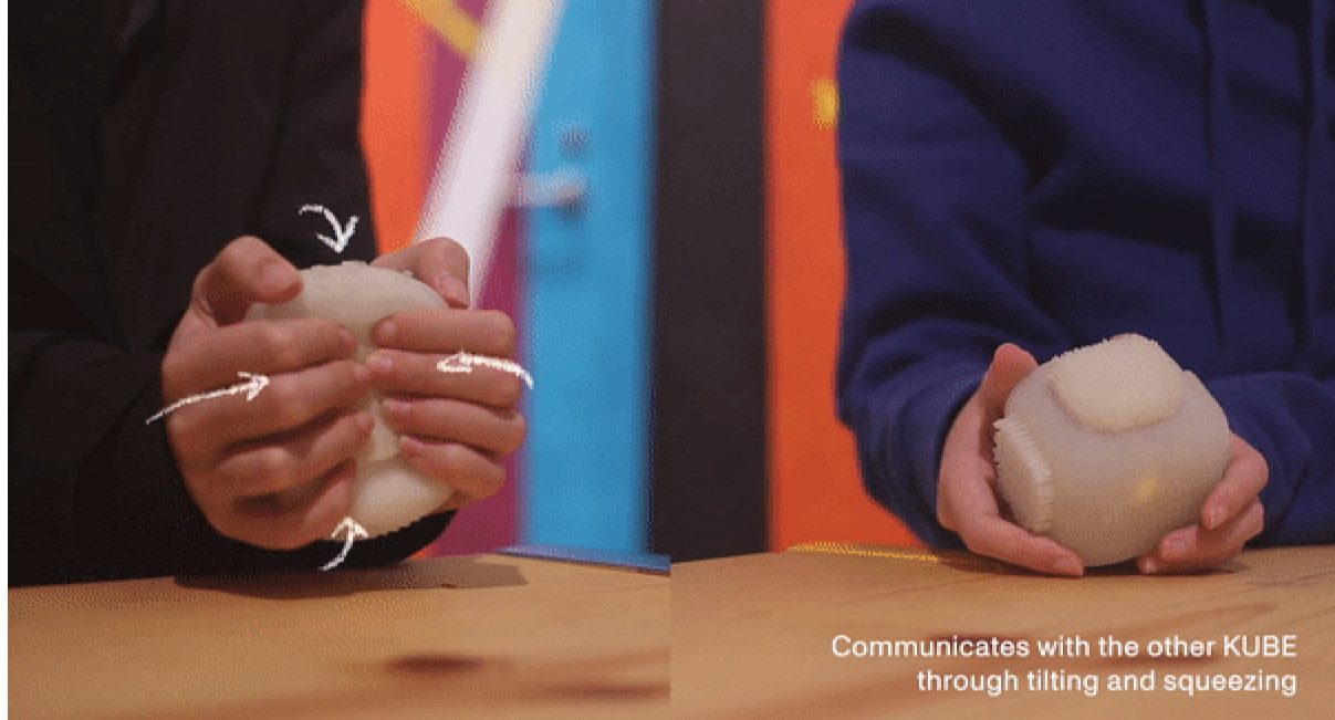 Squeezing one cube to signal the other