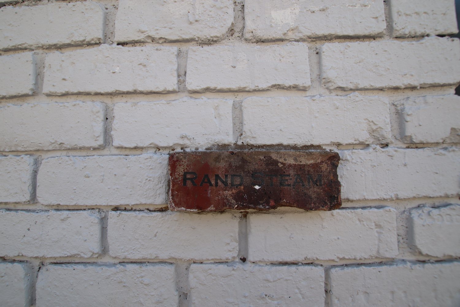 An original brick set into the new brickwork